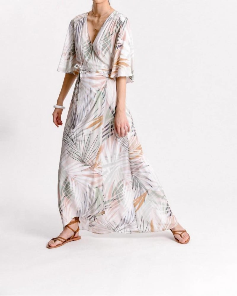 Front of a model wearing a size L Printed Sunset Palm Wrap Dress in Beige Palm Beach in Beige Palm Beach by MOLLY BRACKEN. | dia_product_style_image_id:335116